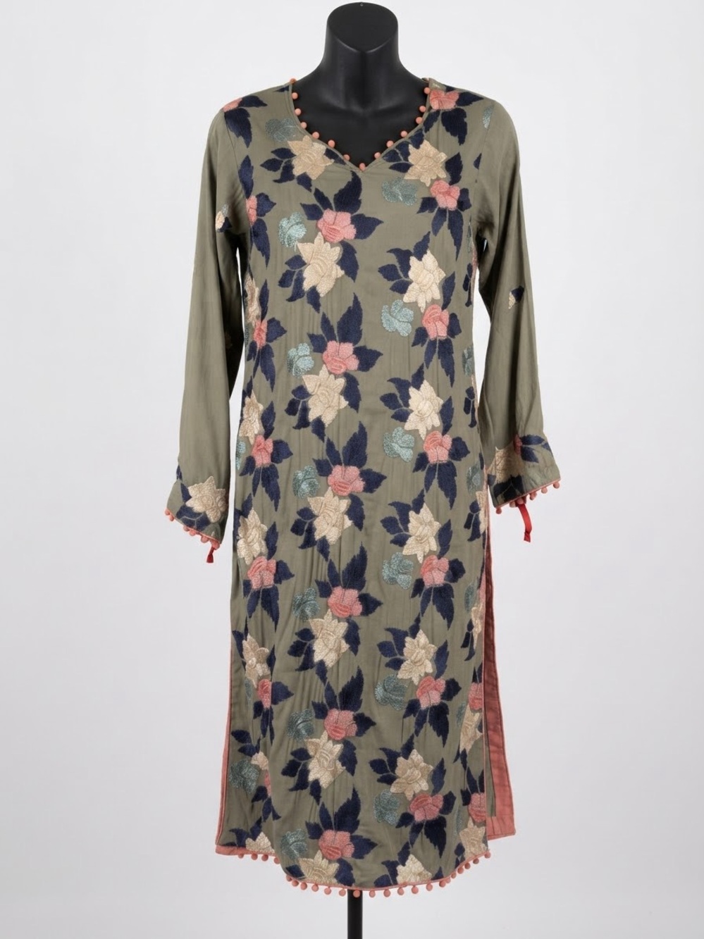 olive green long kurta featuring colorful floral embroidery and delicate pom-pom
